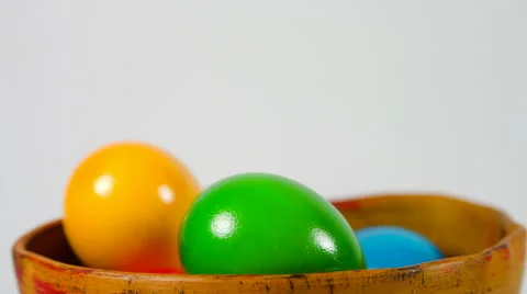 Tilt Over A Bowl Of Easter Eggs Isolated On White Stock-Footage 60070294
