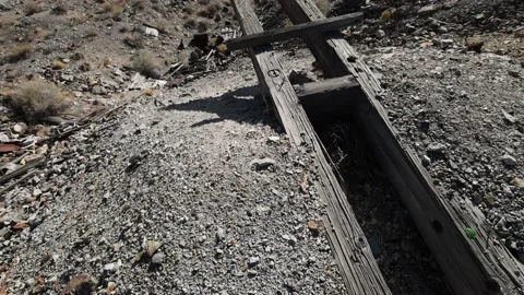 Tilt up over mine ore loading area and hill filled with abandoned trash dirt Stock Footage 144191826