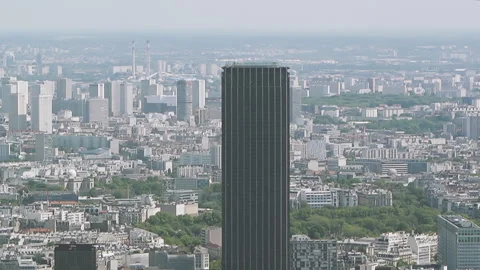 Tilt-up over Parisian cityscape with multiple houses and Tour Montparnasse Stock Footage 131059541