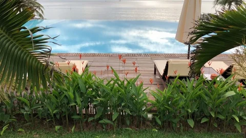 Tilt pan up to infinity pool by the ocean in Vietnam Stock Footage 107573296