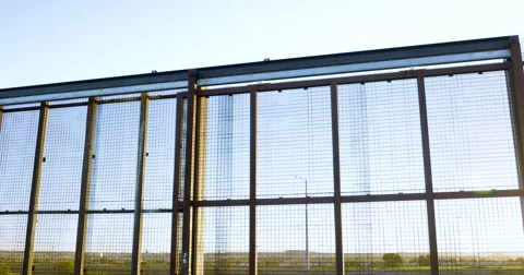 Tilt Up to Reveal the Border Wall Between Mexico and America - 4K 스톡 동영상 67652446