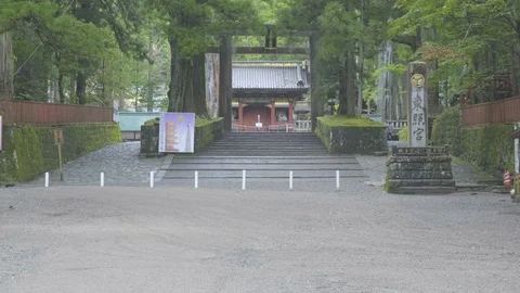 Tilt Up Reveal Uphill View Distant Toshogu Shrine Entrance Torii Nikko Japan Stock Footage 127620087