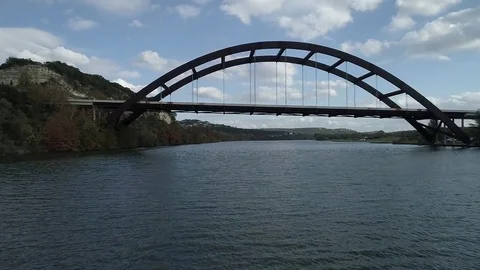 Tilt up the river facing 360 bridge Stock Footage 85137022