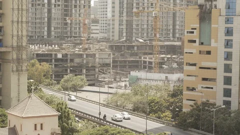 Tilt up from road to highrise in a Business Centre Skyline Stock Footage