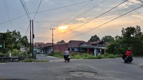 Tilt up from road intersection to sunset sky Stock Footage 342846250