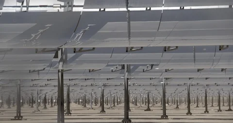 Tilt Up from Rows of Solar Mirror Panels to Broken Mirror Stock Footage 89942864
