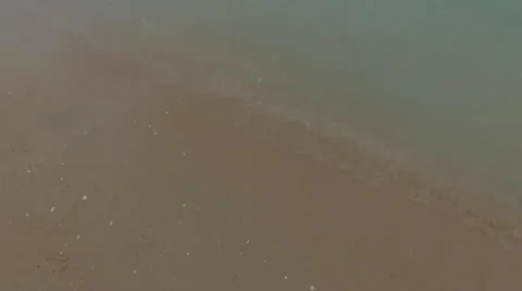 Tilt up from sand to beach Stock Footage 57296436