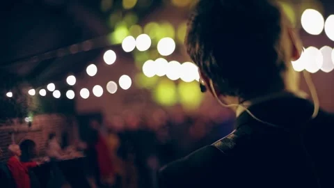 Tilt-shift dreamy effect vocalist with guitar and in-ear headphones on the Stock Footage 150152522
