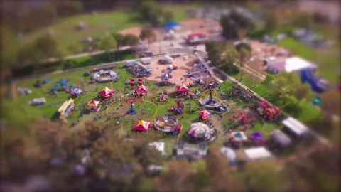 Tilt shift effect makes the nostalgic county fair carnival event look like Stock Footage 149313191