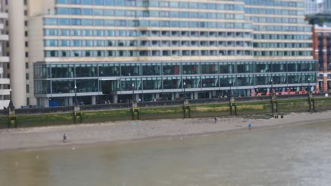 A tilt shift effect of a riverside with people. Stock Footage 138547306