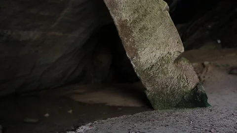 Tilt shift effect of woman walking behind a giant column of a cave, Italy Stock Footage 129570428