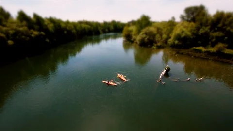 Tilt-Shift: Funny shot of Mini Kayak‘s going in circles river in La Rioja, Spain Stock Footage 97993350
