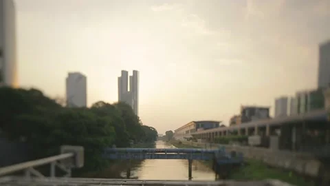 Tilt shift  landscape of the river in the middle of the city of jakarta 스톡 동영상 222504843