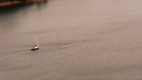 Tilt shift: Miniature Sailboat passing by at Acadia National Park in Maine, USA. Stock Footage 100059277
