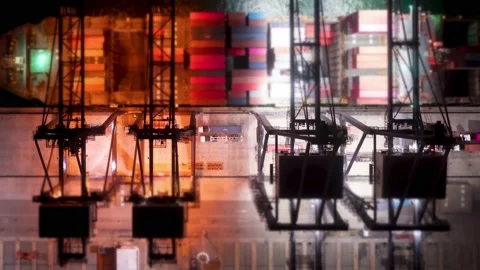 Tilt-shift Night Time lapse Aerial of cargo ship loading containers at the port. Stock-Footage 218376396