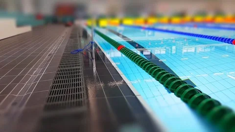 Tilt shift overview close up video of swimming pool before a competition Stock Footage 120359362