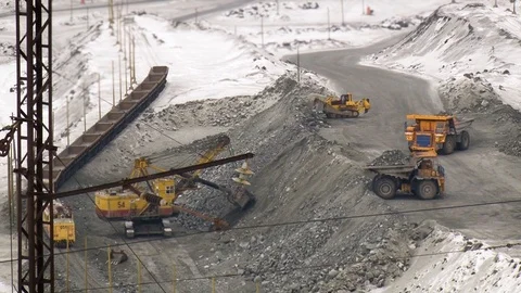 Tilt shift perspective of trucks excavating in quarry. Mining operations. Stockbeeldmateriaal 119155377