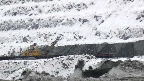 Tilt shift perspective of trucks excavating in quarry. Mining operations. Stock Footage 126219254