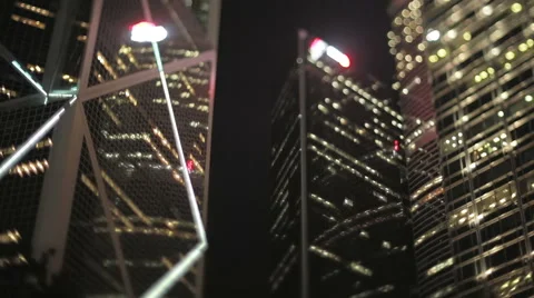 Tilt-shift shot looking up at brightly lit offices at night, Hong Kong Stock Footage 57103835