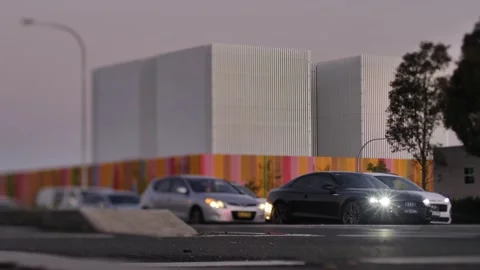 Tilt shift slow motion Traffic line with modern architecture background 4K Stock Footage 235537566