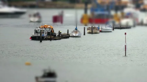 Tilt shift of some small boats tied to a raft  HD Stock Footage 6530902
