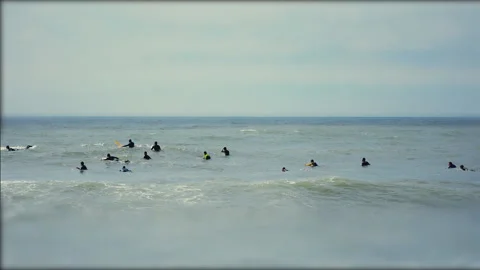 Tilt Shift Surfers Catching Waves Vídeo Stock 97117859