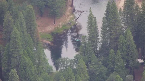Tilt-shift time-lapse of boats floating down the river in the Yosemite Valley Stock Footage 134577403