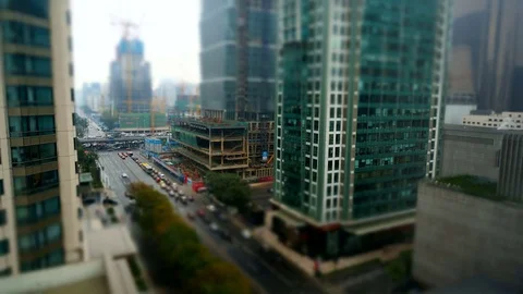 Tilt Shift Time Lapse of Busy City Buildings Видео 77695873