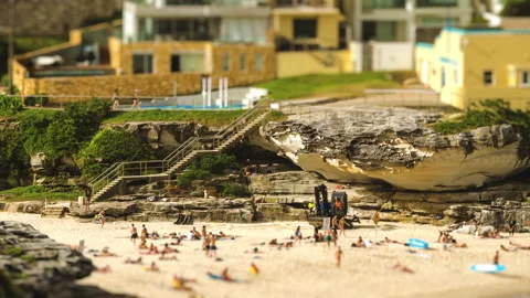 Tilt Shift Timelapse of Miniature Digger On Tamarama Beach Stock Footage 203461829