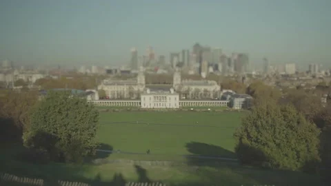 Tilt-shift timelapse of an open park with business district in the background Stock Footage 146455425