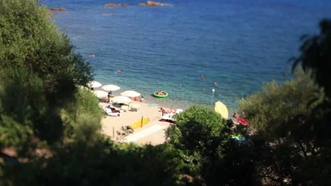 Tilt-Shift, Timelapse. Swimmers play with an inflatable mattress-Sardinia, Italy Stock Footage 221495153