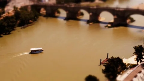 Tilt- shift: Tiny Boat on the Ebro river in Zaragoza, Aragon, Spain Stock Footage 98567015