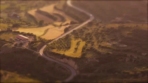 Tilt-shift: Tiny Car driving through landscape in Pyrenees mountains in Spain Stock Footage 98155467