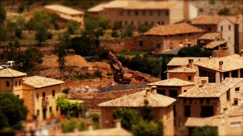 Tilt-shift: Tiny excavator in historic village of Alquézar, Huesca Aragon, Stock Footage 98149428