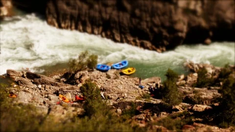 Tilt-shift: Tiny people carring their kayaks to the River Stock Footage 98304864