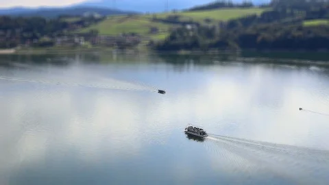 Tilt shift two ships sails on the middle of lake Stock Footage 95247574