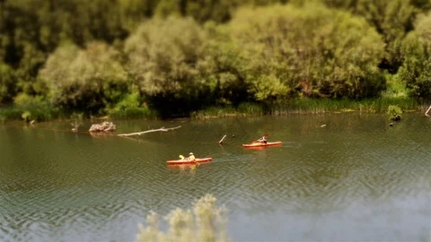 Tilt Shift: Two Toy Kayak‘s paddle on river in La Rioja, Spain Stock Footage 97988106
