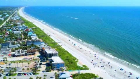 Tilt-shift Vilano Beach 2026 construction beach goers and boats Stock Footage 346643543