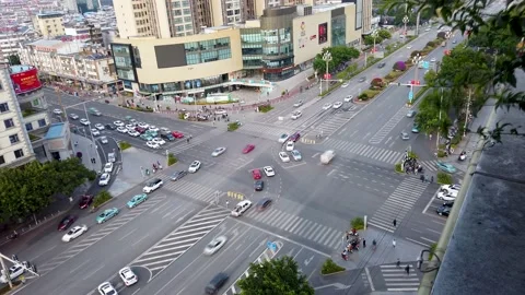 Tilt shit of busy intersection high angle view in China with double left turn Video stock 145017243