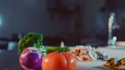 Tilt up shoot of various vegetables and mushrooms in kitchen Stock Footage 104194993