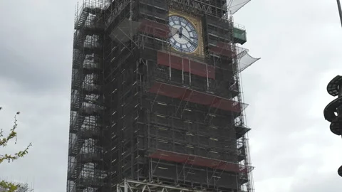 A tilt shot of the Big Ben covered in scaffolding. Stock Footage 154692231