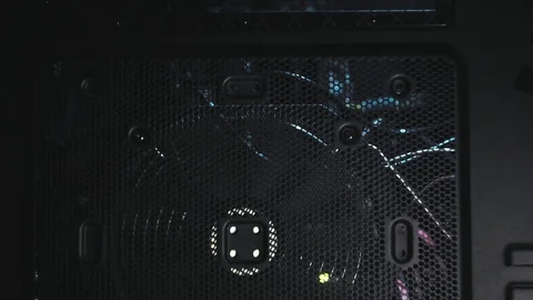 Tilt shot on black tower side with big spinning fan. Flicker blue light insde Видео 101372467