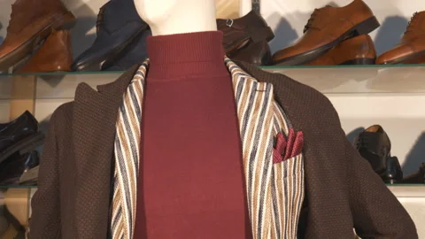 A tilt shot of a blazer and a coat. Stock Footage 123780488
