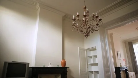 Tilt Shot From Ceiling To Floor Inside A House With Furniture Stock Footage 126700574