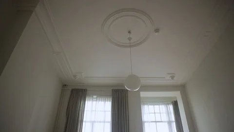 Tilt Shot From Ceiling To Floor Inside A Stunning House With Lots Of Space Video stock 126700577