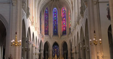 Tilt up shot of dimly lit alter in the interior of a roman catholic church Stock Footage 255693516