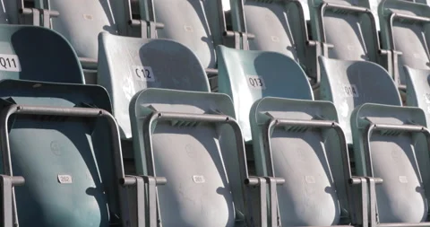 Tilt up shot, empty stadium seats seen from the front. Loosing Games and Stock Footage 138714095