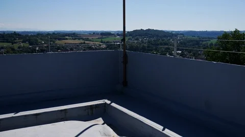 Tilt shot of a flag blowing in the wind on top of a medieval french castle Stock Footage 112315342