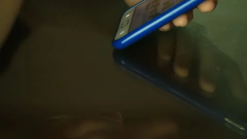 Tilt-up shot of Hands using smartphone Stock Footage 11314843