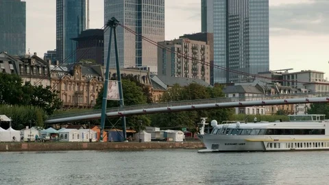 Tilt shot from Holbeinsteg bridge to Frankfurt Skyline Stock Footage